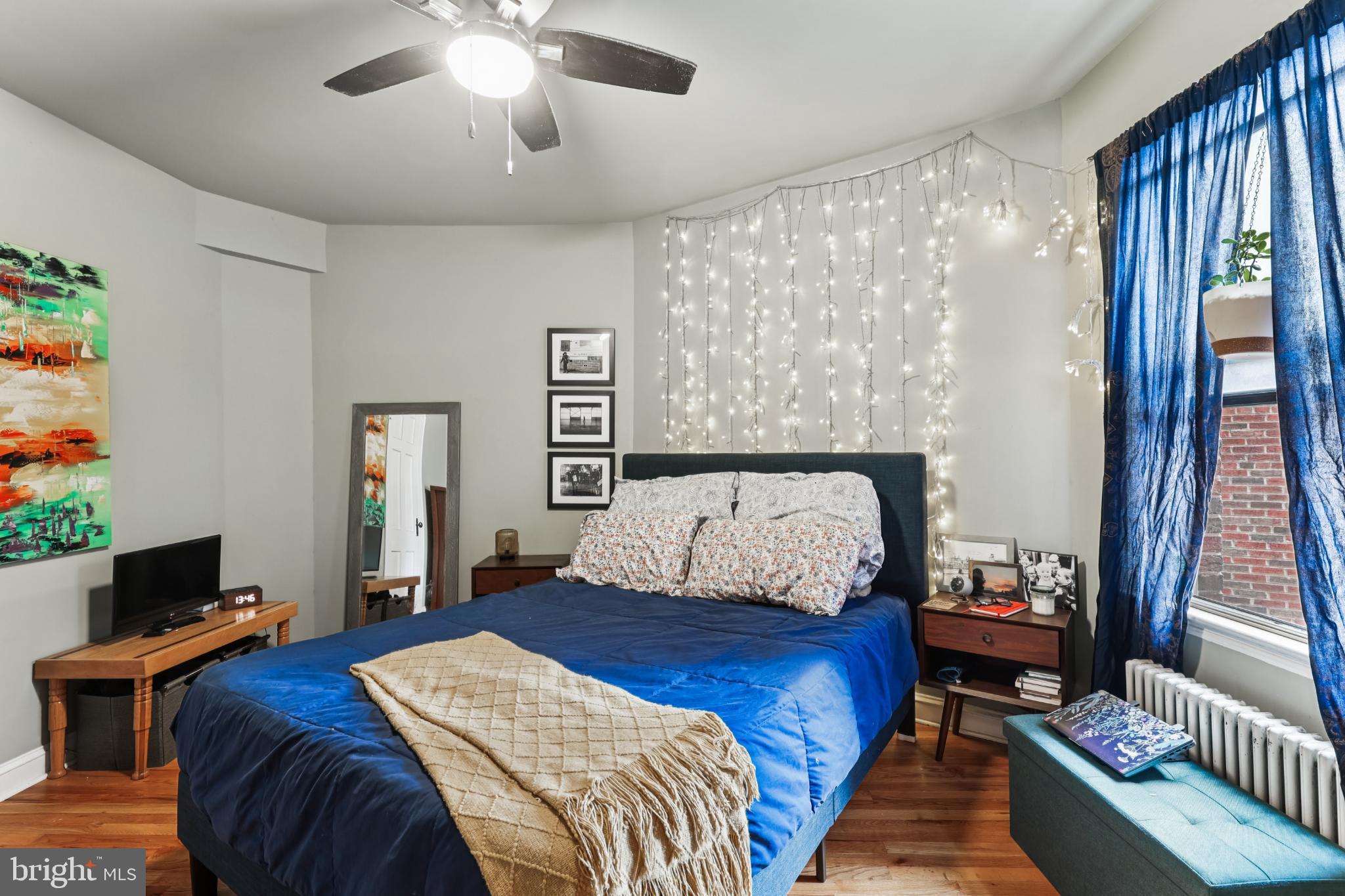 1365 Kennedy Street Northwest, Unit 209 Washington, DC 20011 - Photo 20 of 35 a bedroom with a bed and a chandelier