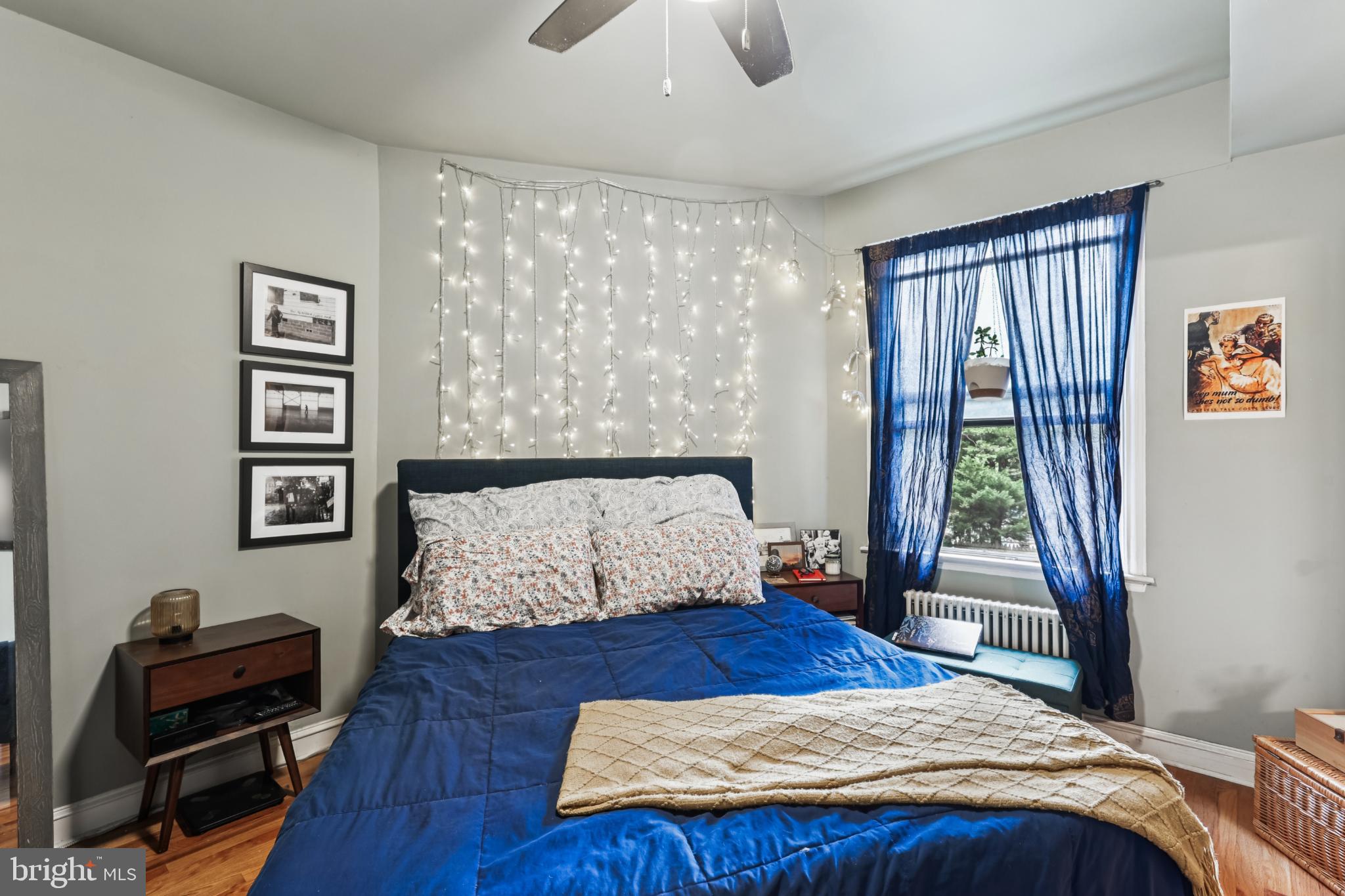 1365 Kennedy Street Northwest, Unit 209 Washington, DC 20011 - Photo 21 of 35 a bedroom with a bed and a window