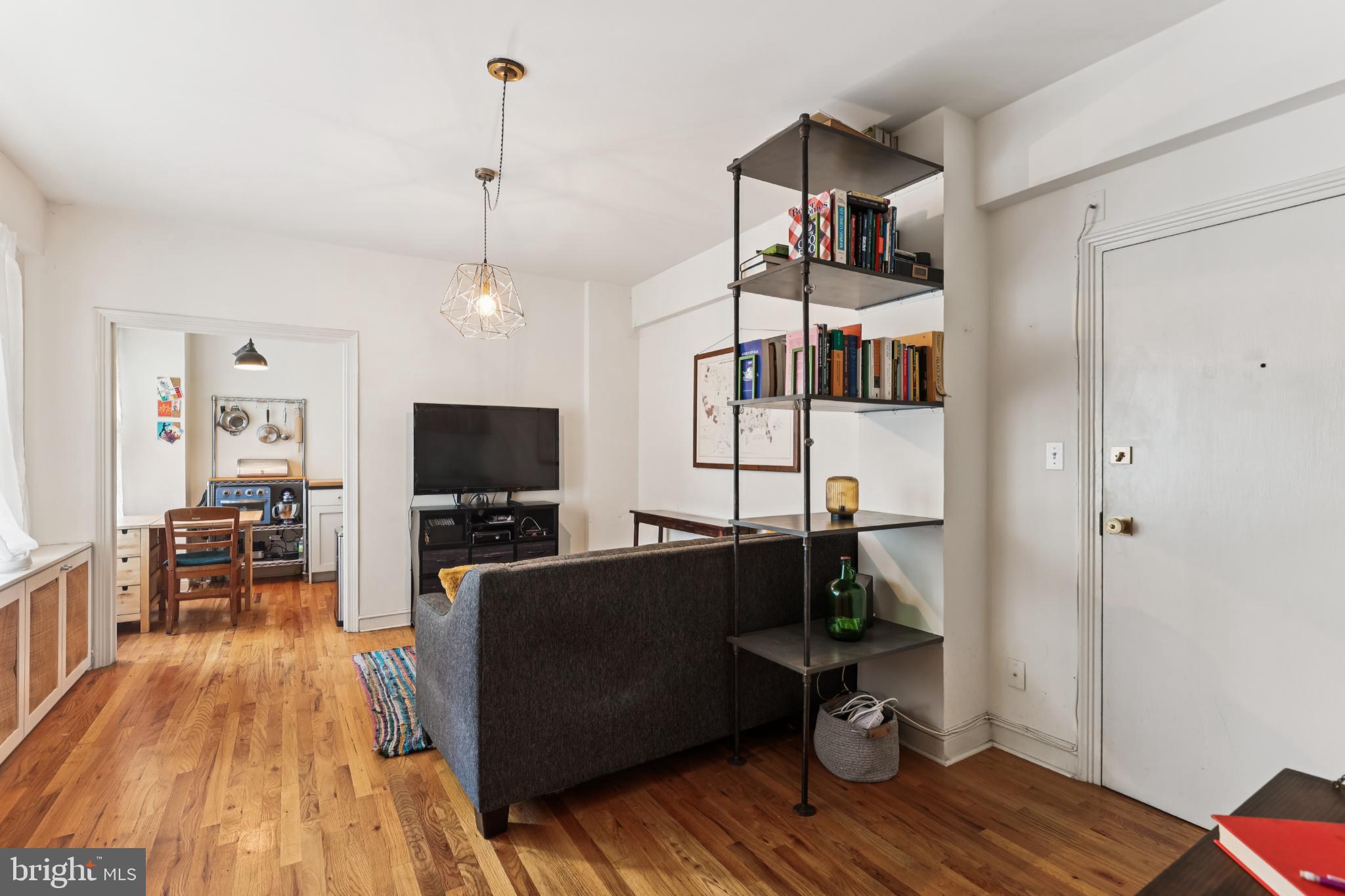 1365 Kennedy Street Northwest, Unit 209 Washington, DC 20011 - Photo 3 of 35 a living room with furniture and a flat screen tv