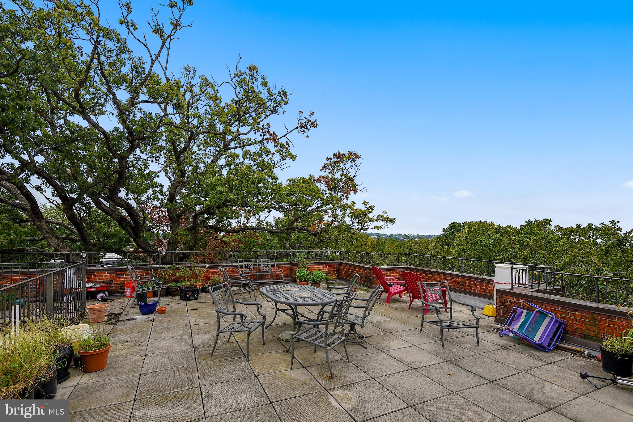 1365 Kennedy Street Northwest, Unit 209 Washington, DC 20011 - Photo 31 of 35 an outdoor sitting area with furniture and wooden fence