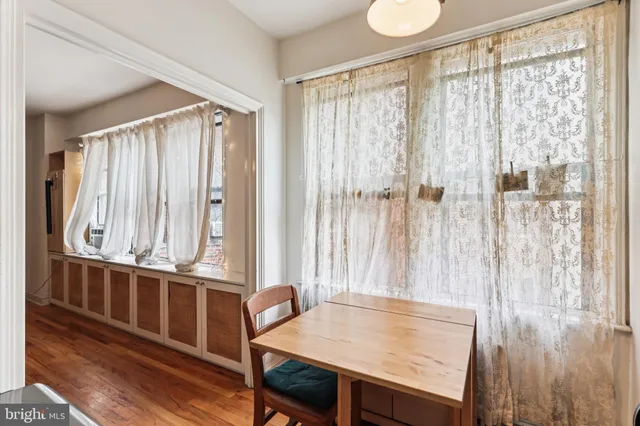 a view of a room with furniture and window