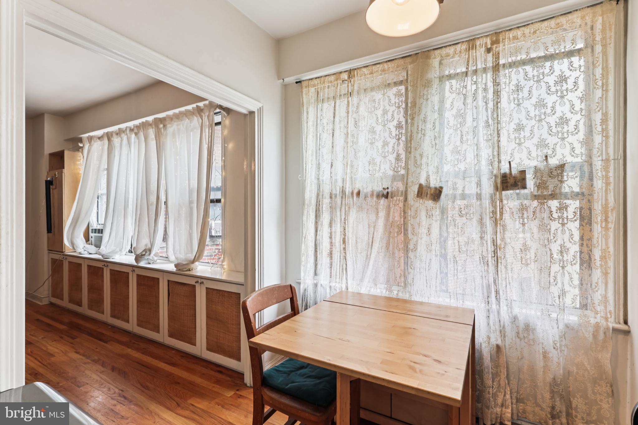 1365 Kennedy Street Northwest, Unit 209 Washington, DC 20011 - Photo 9 of 35 a view of a room with furniture and window