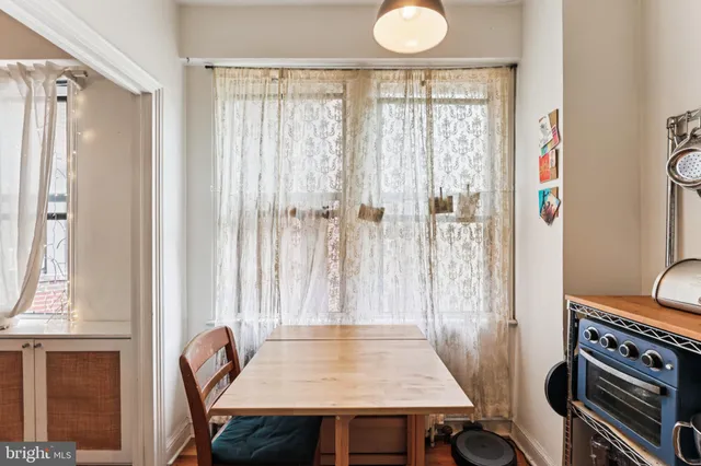 a view of a dining table and chairs in a room