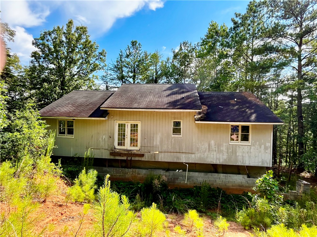 597 Old Hurricane Road Westminster, SC 29693 - Photo 2 of 11 Perched among verdant trees, this property offers a secluded setting.