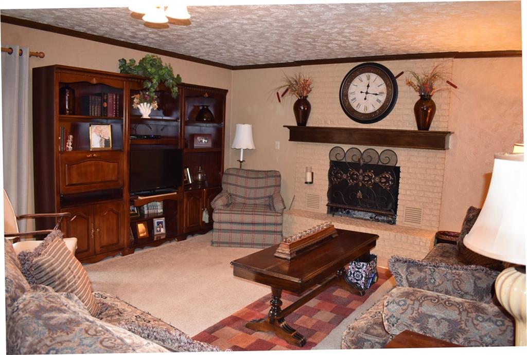190 Becker Road Butler, PA 16002 - Photo 16 of 24 Family room with wood burning fireplace and walkout to lower level deck