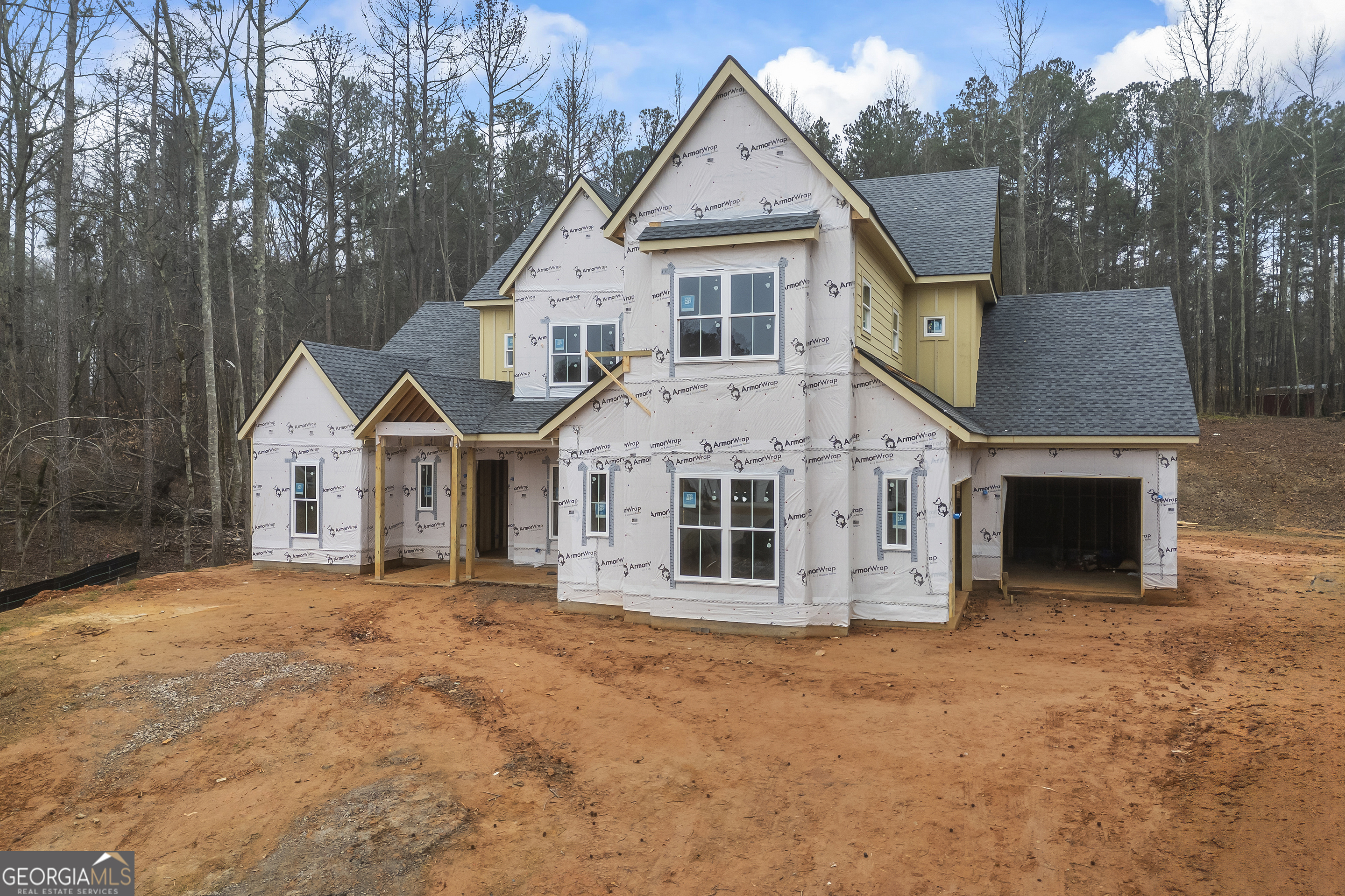 205 Chariot Court Jefferson, GA 30549 - Photo 6 of 23 a view of a house with a yard and large tree