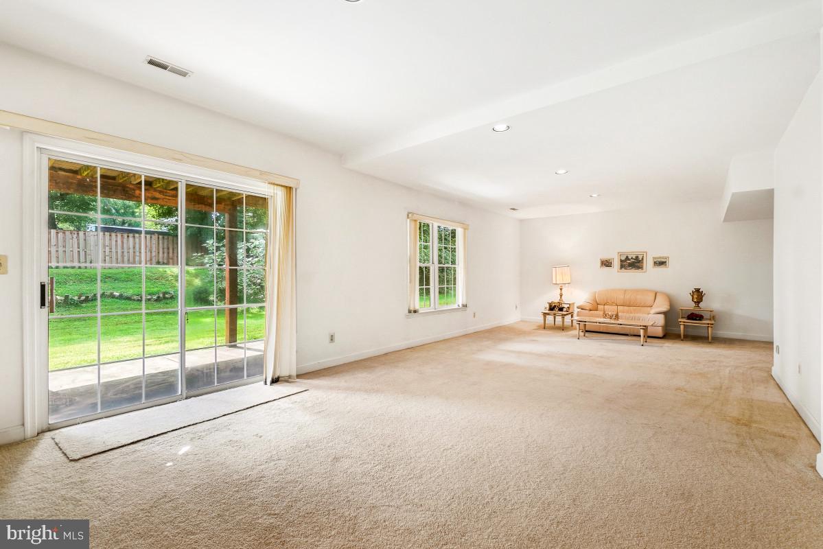 11103 Luttrell Lane Silver Spring, MD 20902 - Photo 25 of 30 Spacious living area with garden views.