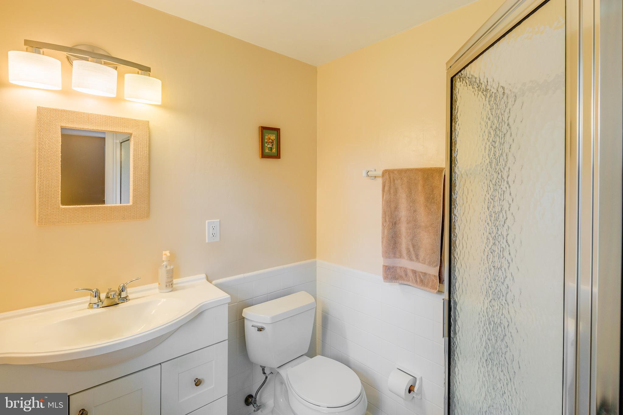 110 Courtland Road Cherry Hill, NJ 08034 - Photo 17 of 28 a bathroom with a toilet a sink and mirror