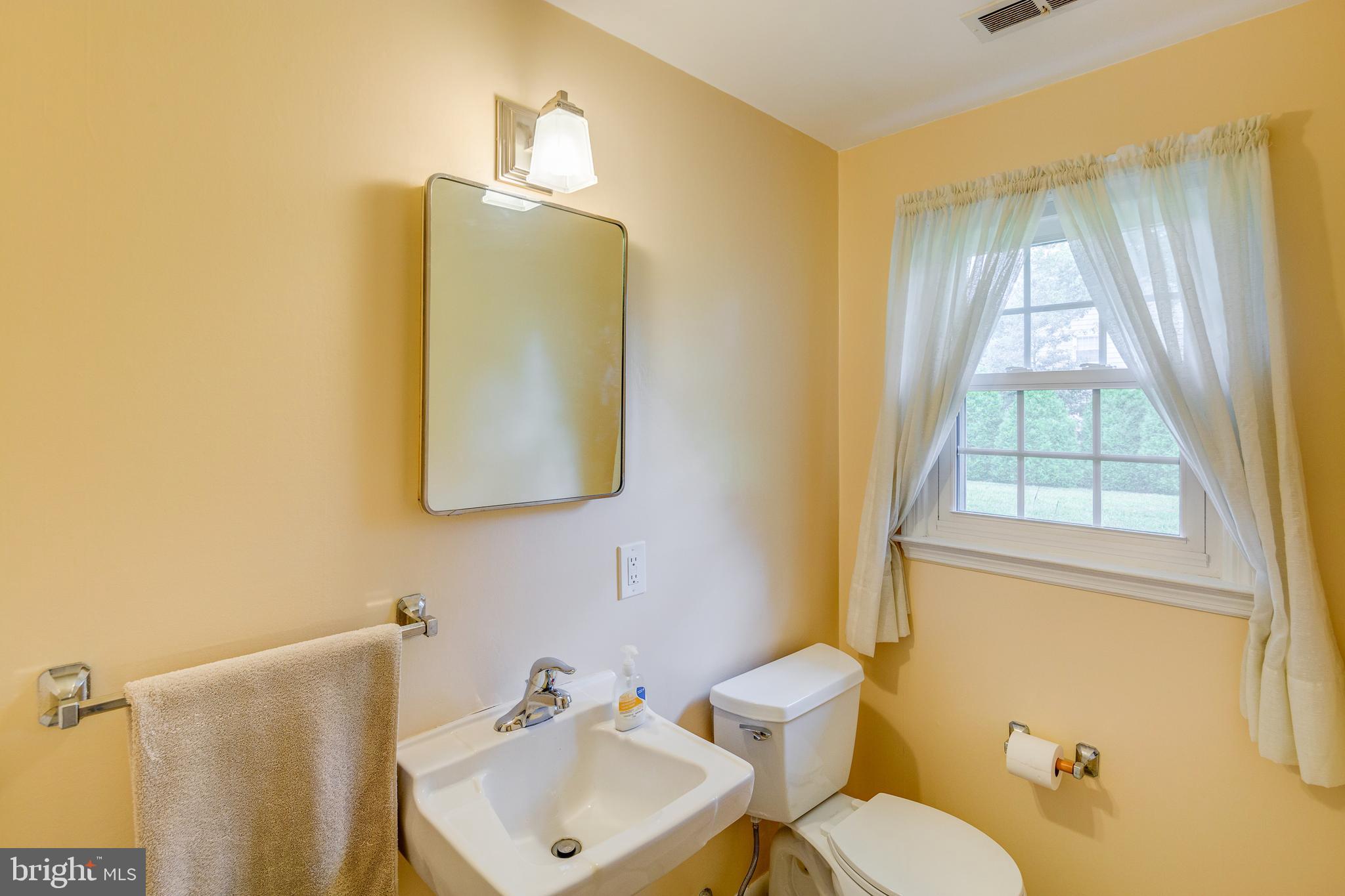 110 Courtland Road Cherry Hill, NJ 08034 - Photo 22 of 28 a bathroom with a sink and mirror with toilet