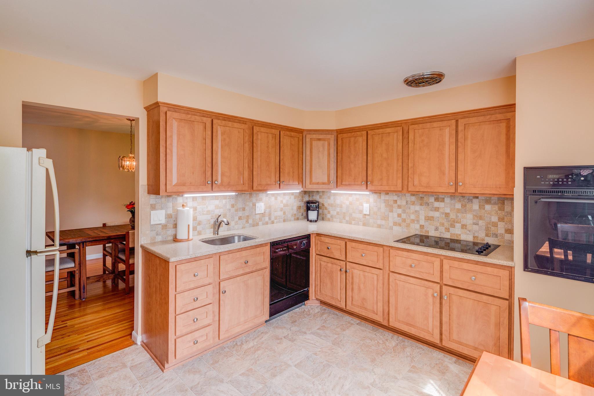 110 Courtland Road Cherry Hill, NJ 08034 - Photo 9 of 28 a kitchen with granite countertop a sink stove and cabinets