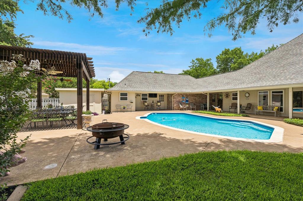 404 Moonlight Lane Keller, TX 76248 - Photo 3 of 40 a house with a large pool in front of it
