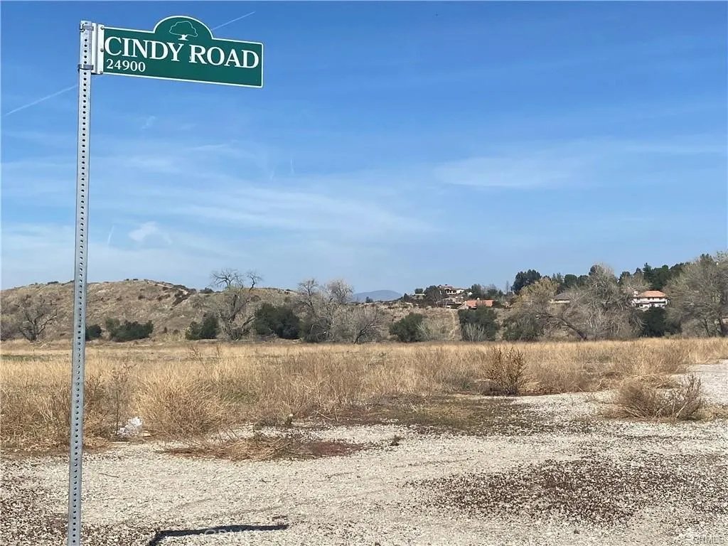 a view of a street with a building in the background