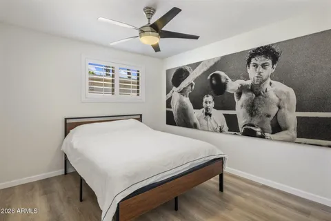a bedroom with a large bed and a large window