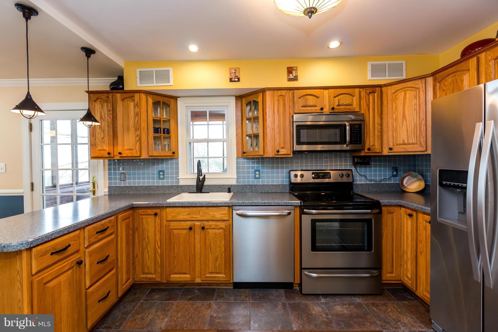 6602 Wind Ridge Road Mount Airy, MD 21771 - Photo 8 of 30 Kitchen has new stainless steel appliances