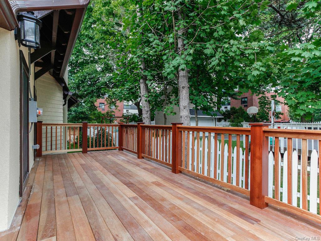 a view of deck with wooden floor and fence