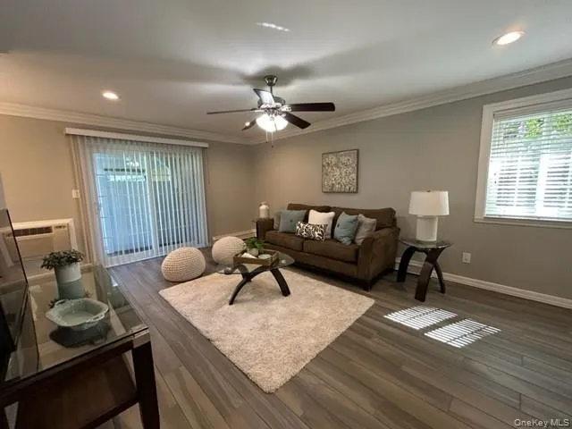 a living room with furniture and a window