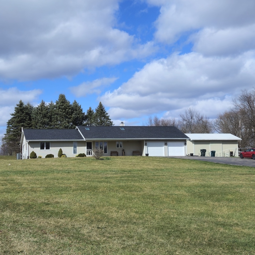 a view of a house with a yard