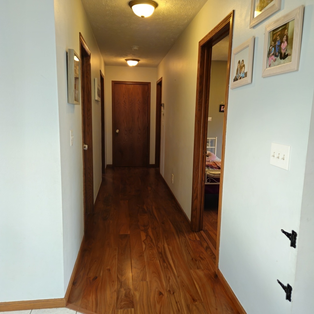 5096 Rotary Road Cherry Valley, IL 61016 - Photo 13 of 28 a view of hallway with wooden floor