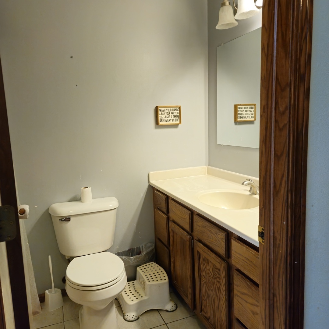 5096 Rotary Road Cherry Valley, IL 61016 - Photo 14 of 28 a bathroom with a toilet and a sink