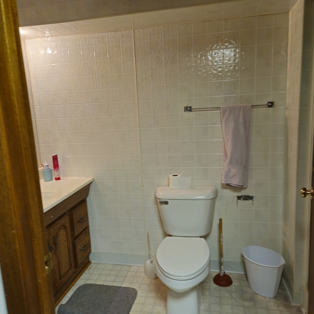5096 Rotary Road Cherry Valley, IL 61016 - Photo 21 of 28 a bathroom with a toilet and a shower