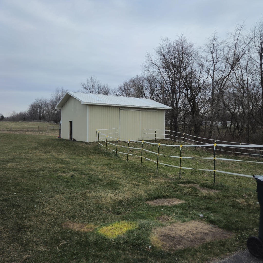 5096 Rotary Road Cherry Valley, IL 61016 - Photo 24 of 28 a view of a backyard