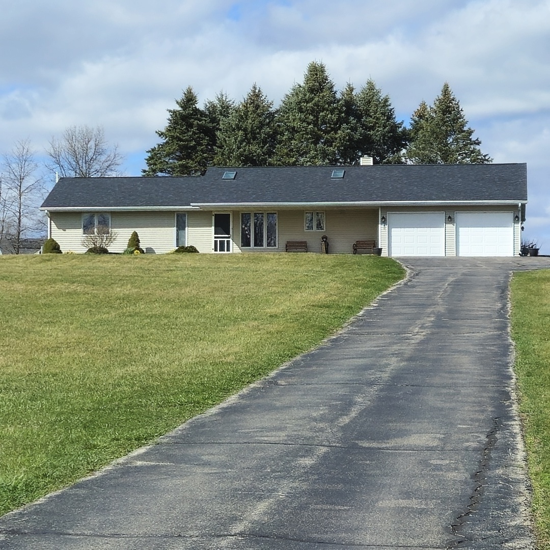 5096 Rotary Road Cherry Valley, IL 61016 - Photo 3 of 28 front view of a house with a yard