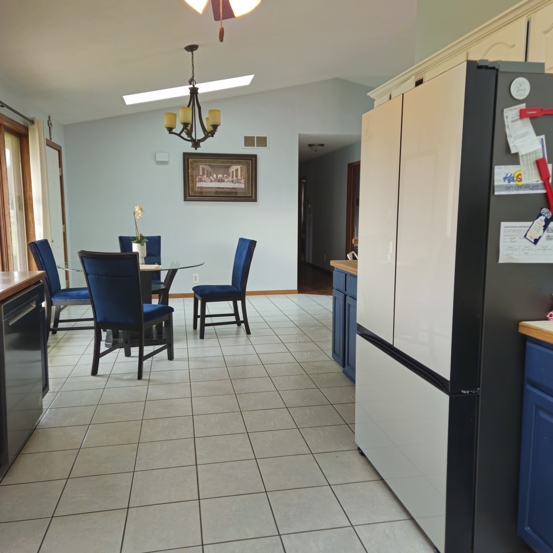 5096 Rotary Road Cherry Valley, IL 61016 - Photo 5 of 28 a view of a dining room with furniture and a chandelier