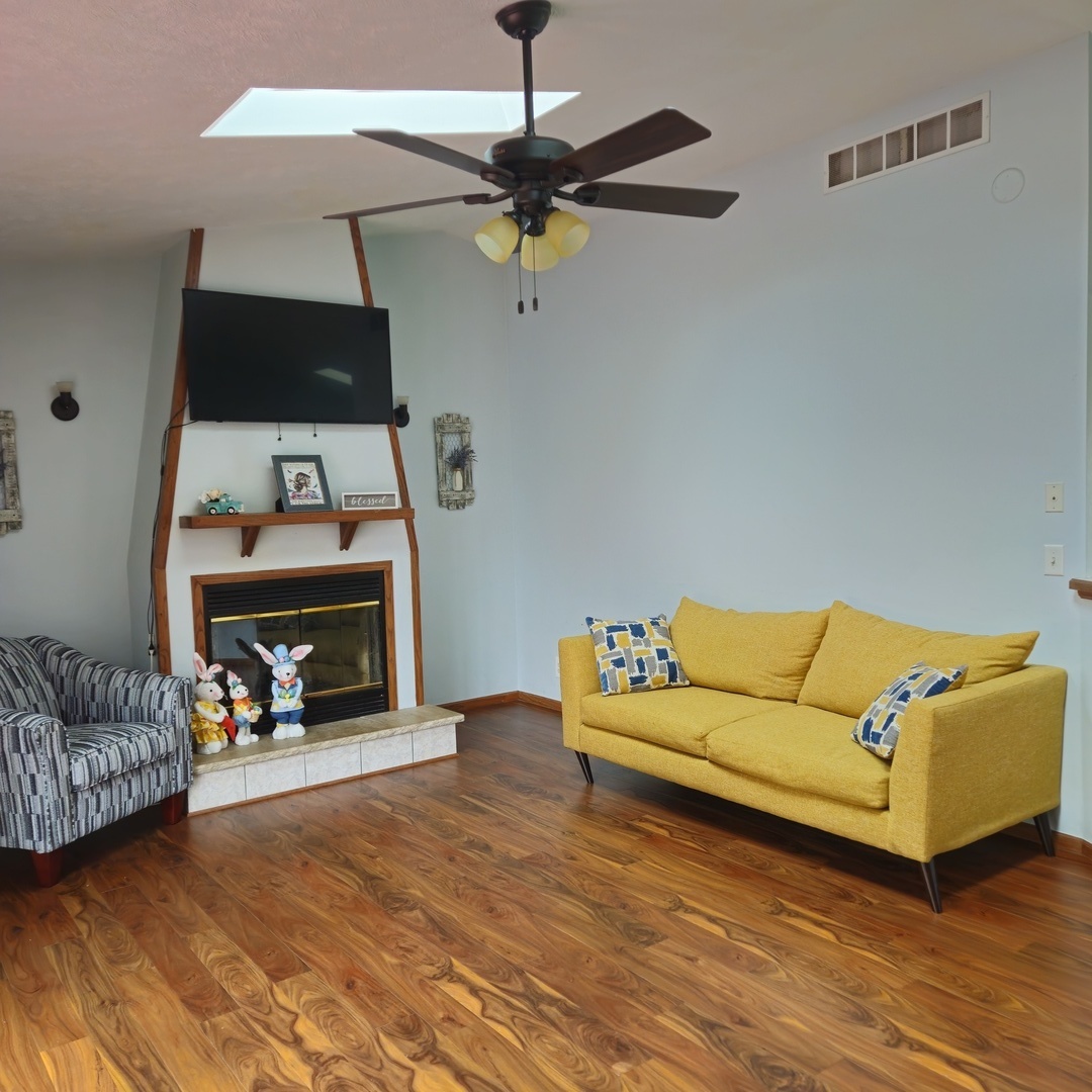 5096 Rotary Road Cherry Valley, IL 61016 - Photo 9 of 28 a living room with furniture and a fireplace
