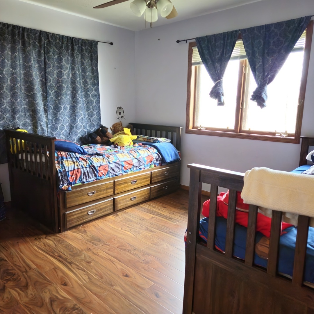 5096 Rotary Road Cherry Valley, IL 61016 - Photo 10 of 28 a bedroom with furniture and window