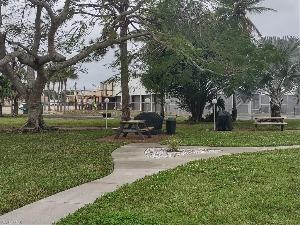 2100 Barkeley Lane, Unit 13 Fort Myers, FL 33907 - Photo 4 of 12 a view of a park with large trees