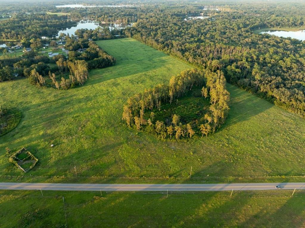 16405 Boy Scout Road Odessa, FL 33556 - Photo 9 of 13 a view of a lake with a yard