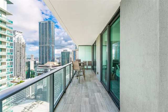 a view of balcony with furniture