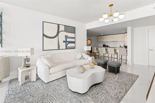 a living room with furniture and a rug