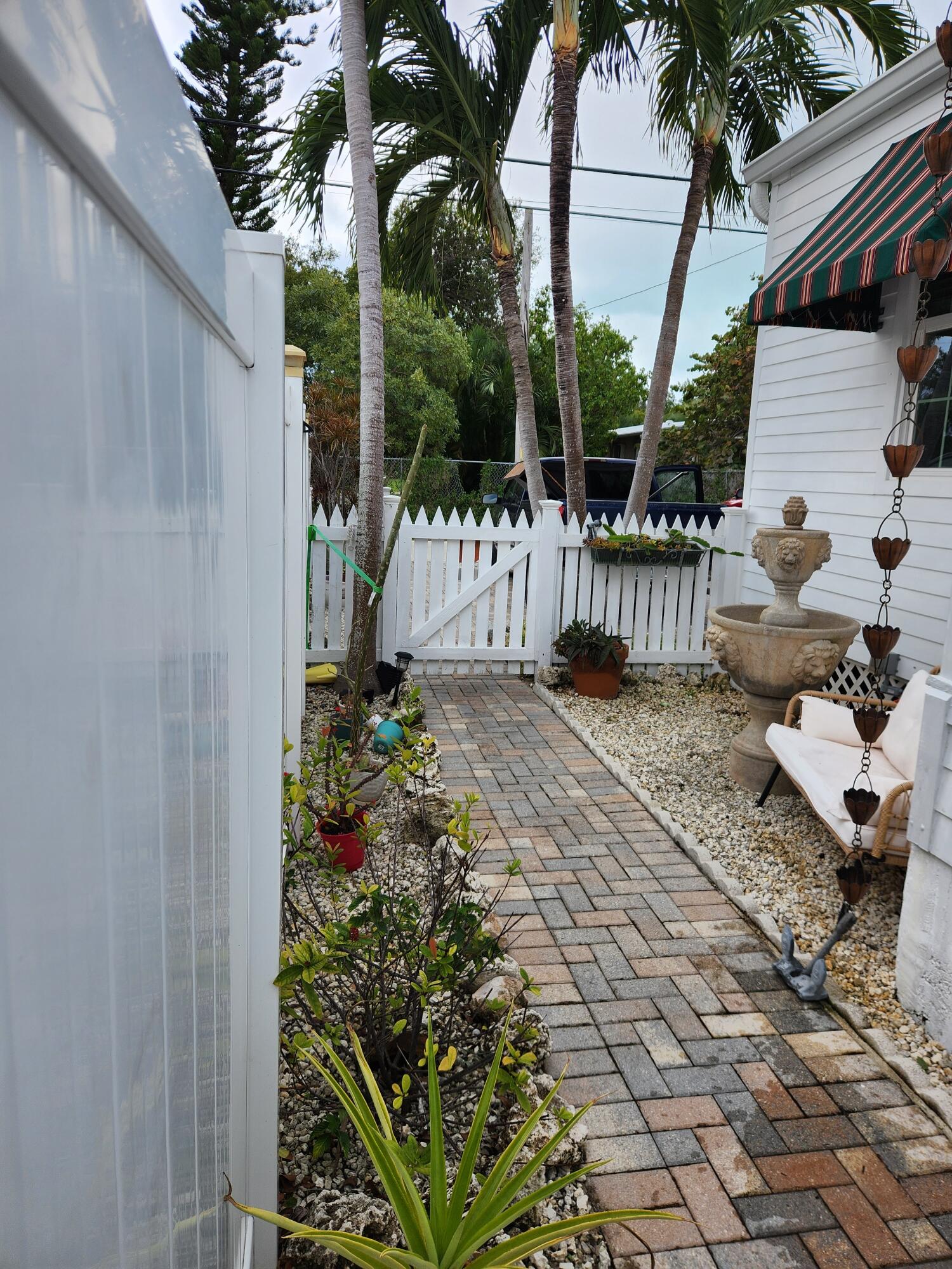 331 Ave F Key West, FL 33040 - Photo 11 of 18 East Side garden and Walkway
