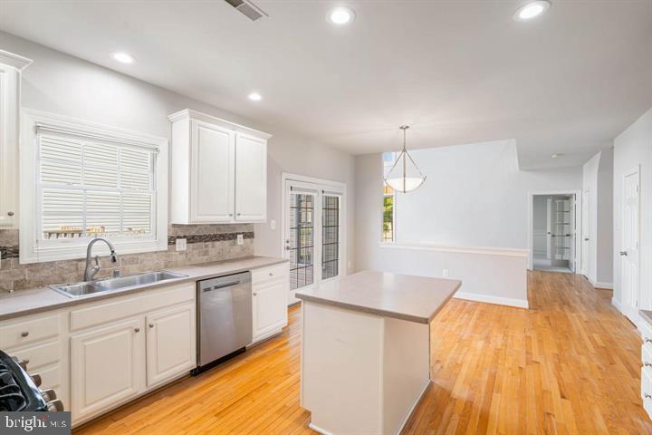 2038 Madrillon Road Vienna, VA 22182 - Photo 17 of 63 a spacious bathroom with a granite countertop sink a mirror and a bathtub