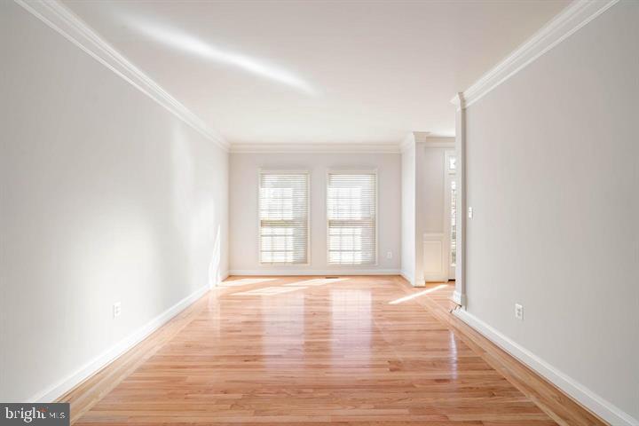 2038 Madrillon Road Vienna, VA 22182 - Photo 18 of 63 a view of an empty room with a window and wooden floor