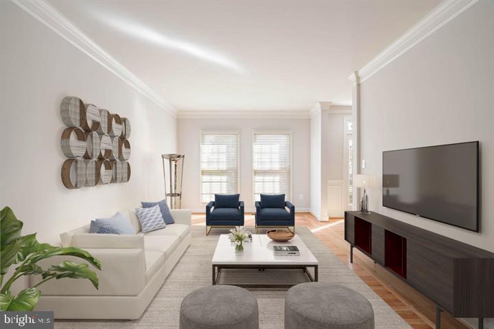 2038 Madrillon Road Vienna, VA 22182 - Photo 19 of 63 a living room with furniture a flat screen tv and a large window