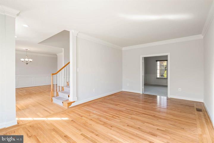 2038 Madrillon Road Vienna, VA 22182 - Photo 20 of 63 a view of a livingroom with wooden floor and a hallway