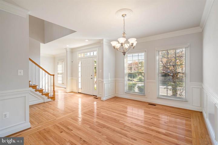 2038 Madrillon Road Vienna, VA 22182 - Photo 22 of 63 a view of empty room with wooden floor fan and window