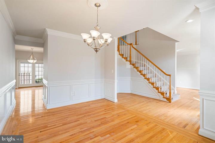 2038 Madrillon Road Vienna, VA 22182 - Photo 24 of 63 a view of a livingroom with wooden floor and stairs