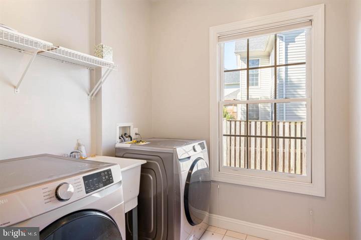 2038 Madrillon Road Vienna, VA 22182 - Photo 31 of 63 a utility room with dryer and washer