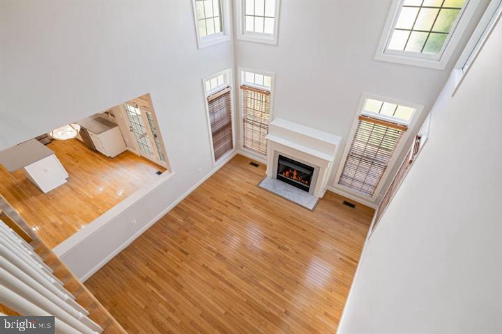 2038 Madrillon Road Vienna, VA 22182 - Photo 35 of 63 a living room with furniture and a fireplace