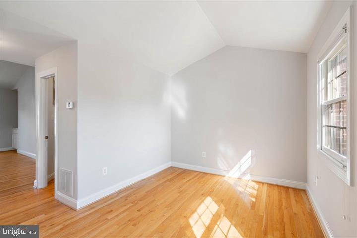 2038 Madrillon Road Vienna, VA 22182 - Photo 36 of 63 a view of empty room with wooden floor