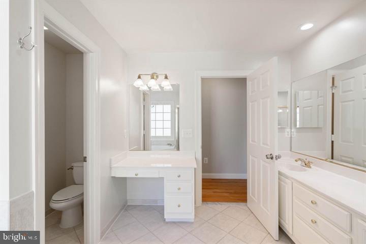 2038 Madrillon Road Vienna, VA 22182 - Photo 43 of 63 a bathroom with a sink a toilet and shower