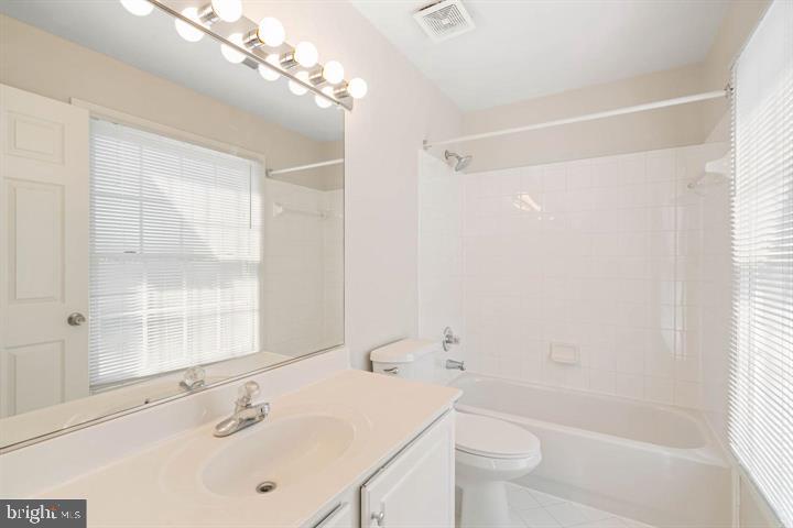 2038 Madrillon Road Vienna, VA 22182 - Photo 50 of 63 a bathroom with a sink a toilet and shower