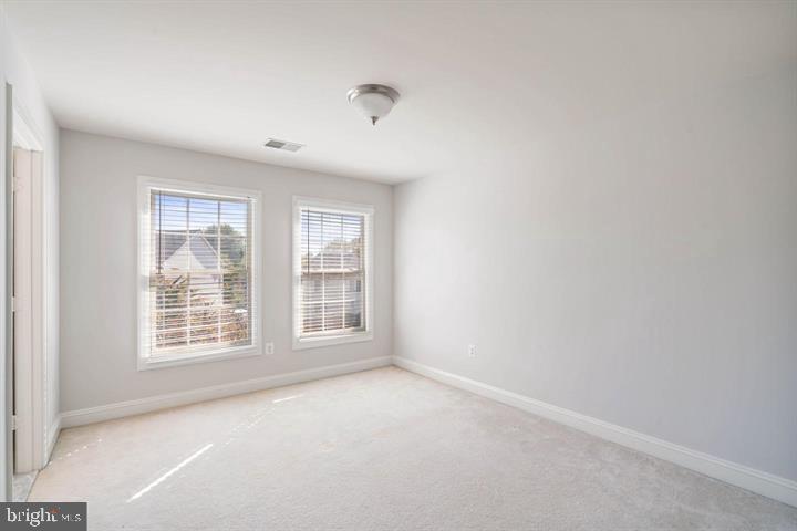 2038 Madrillon Road Vienna, VA 22182 - Photo 51 of 63 an empty room with windows