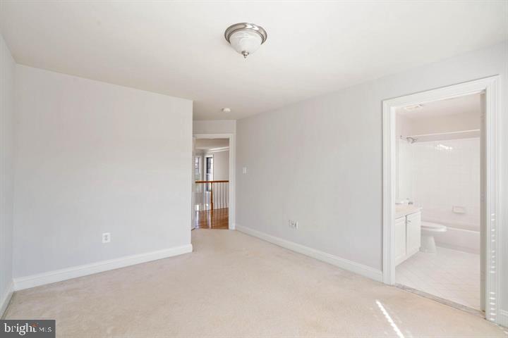 2038 Madrillon Road Vienna, VA 22182 - Photo 52 of 63 a view of a room with an empty space and a bathroom