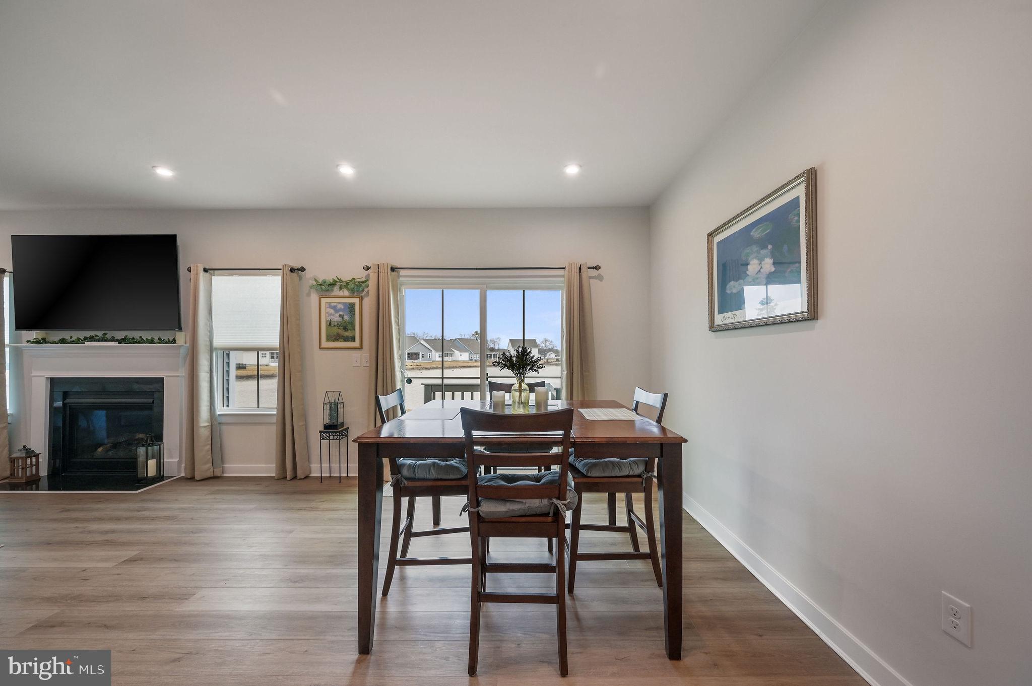 30366 Indigo Way Georgetown, DE 19947 - Photo 17 of 37 a view of a a dining room with furniture window and wooden floor