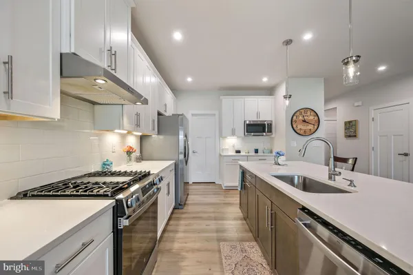 a kitchen with lots of counter top space and a sink