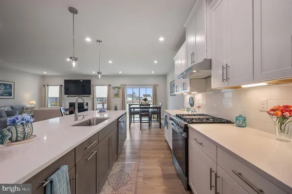 a large kitchen with a table and chairs